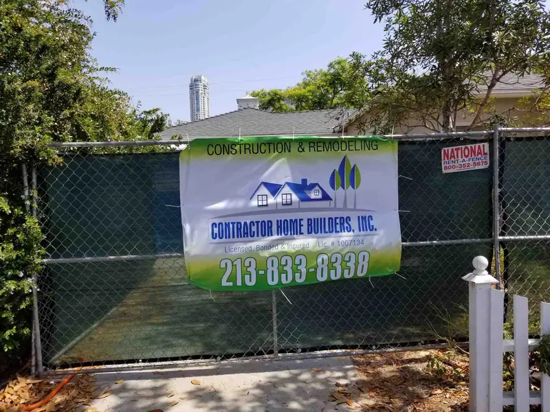 Contractor Home Builders job site with company banner